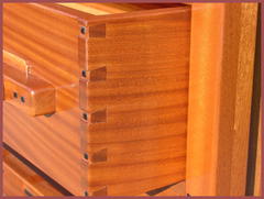 Detail exposed dovetail drawer construction and Ebony pegs.
